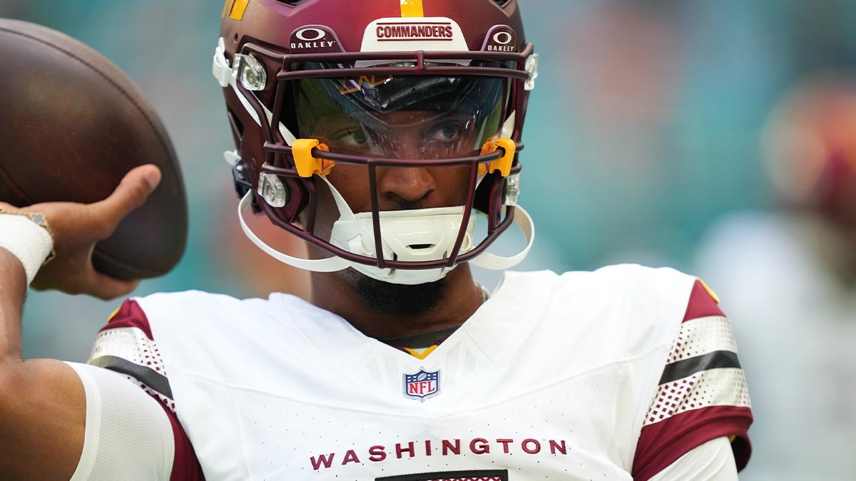 Washington Commanders quarterback Jayden Daniels (5) warms up before the preseason game against the Miami Dolphins at Hard Rock Stadium.