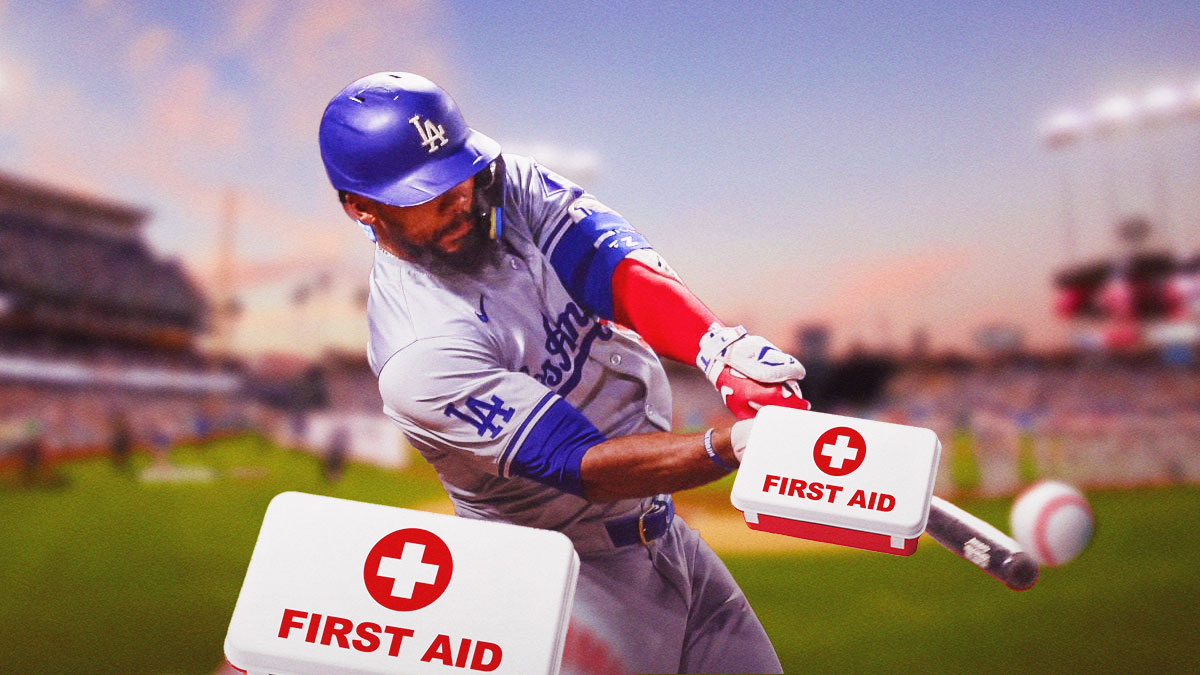 Teoscar Hernandez batting in a Los Angeles Dodgers uniform with a red and white first aid symbol as Hernandez injured is foot and will miss a game but won't be latest Dodgers injuries as the Dodgers playoffs hopes depend on health.