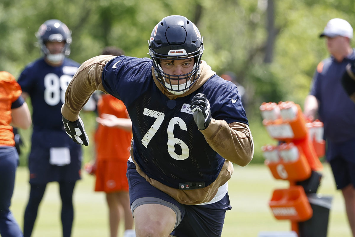 Chicago Bears offensive tackle Teven Jenkins (76) runs during organized team activities at Halas Hall. 