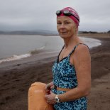 Article thumbnail: Jo Bateman, who attempts a sea swim every day in Exmouth, is taking South West Water to Court over illegal sewage dumping (Photo: Abbie Trayler-Smith)