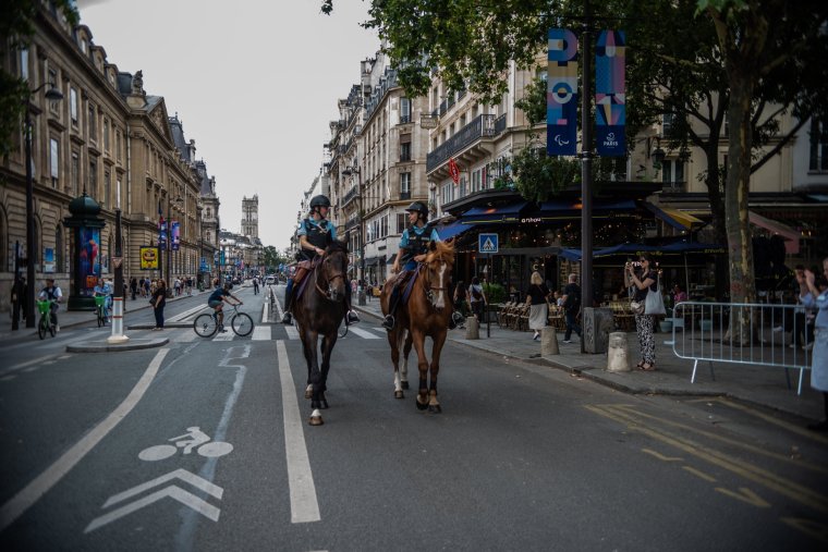 Policewomen are riding on horseback along the rue de Rivoli two days before the opening ceremony of the Paris 2024 Olympics in Paris, France, on July 24, 2024. (Photo by Andrea Savorani Neri/NurPhoto via Getty Images)