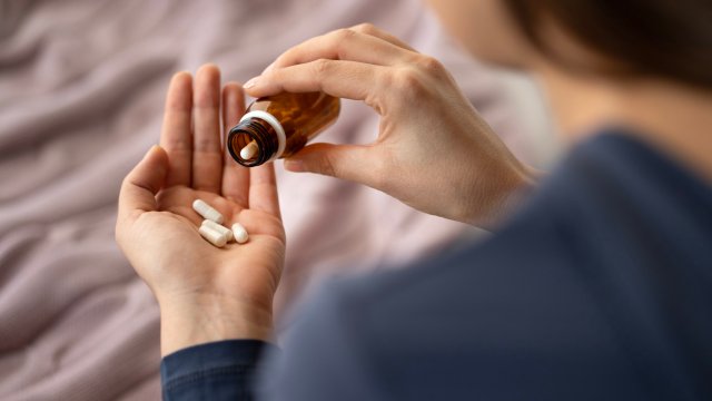 Article thumbnail: Closeup of woman hand pouring capsules from a pill bottle into hand