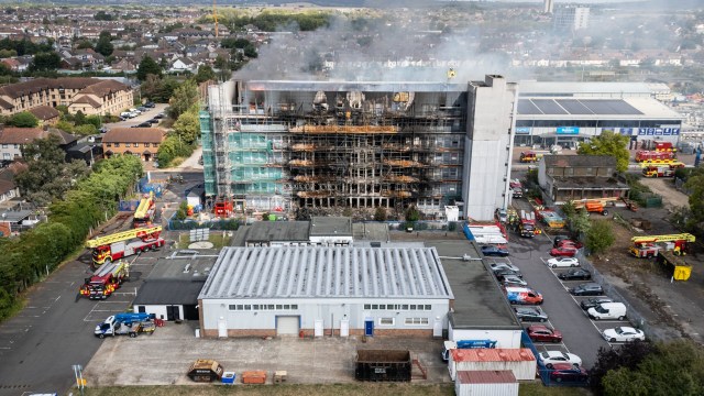 Article thumbnail: DAGENHAM, ENGLAND - AUGUST 26: Aerial view of fire teams attempting to extinguish a major fire in an apartment block on August 26, 2024 in Dagenham, England. Over 100 residents have been evacuated after a fire engulfed a tower block in east London. Fire services were called to the blaze at 2:44 this morning. The building was undergoing works to remove unsafe cladding, similar to that used on Grenfell Tower. (Photo by Leon Neal/Getty Images)