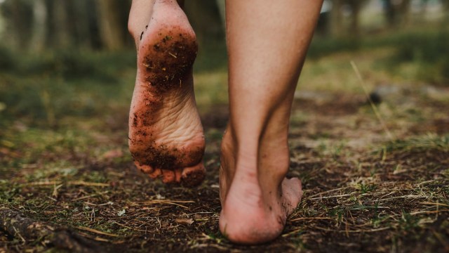 Article thumbnail: bare feet walking on the earth