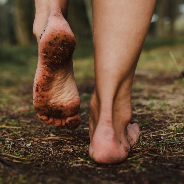 Article thumbnail: bare feet walking on the earth