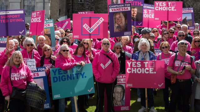 Article thumbnail: LONDON, UNITED KINGDOM - APRIL 29, 2024: Campaigners from Dignity in Dying organisation take part in a rally outside Houses of Parliament in support of assisted dying as Members of Parliament debate in Commons proposals to changing the law on assisted dying in London, United Kingdom on April 29, 2024. (Photo credit should read Wiktor Szymanowicz/Future Publishing via Getty Images)