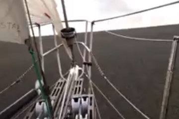 Boat sails through gargantuan sheet of floating rocks