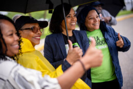 Angela Alsobrooks poses with supporters at a polling location