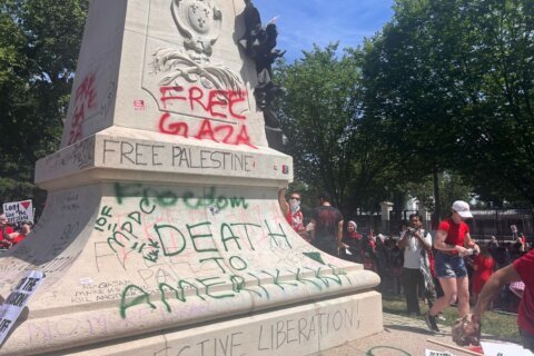 Protesters graffiti messages of Palestinian support outside the White House