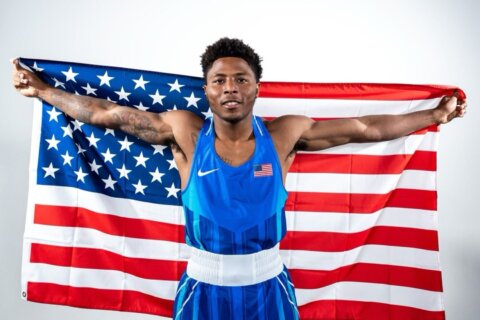 boxers poses with american flag