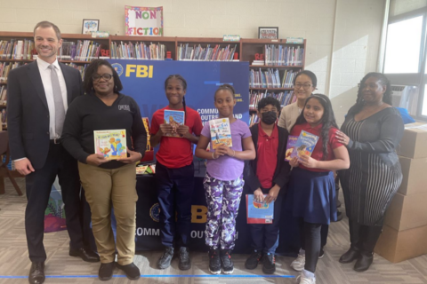 Book ‘em: FBI agents from around the DC area donate 2K books to elementary school