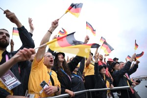 PARIS, FRANCE - JULY 26: Athletes from team Germany wave flags aboard a boat on the River Seine during the opening ceremony of the Olympic Games Paris 2024 on July 26, 2024 in Paris, France.  (Photo by Annegret Hilse-Pool/Getty Images)