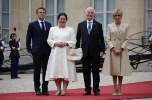 France's President Emmanuel Macron (L) and his wife Brigitte Macron (R) greet New Zealand's Governor-General Alcyion Cynthia Kiro (2L) and her husband Richard Davies (2R)on their arrival ahead of a reception for heads of state and governments ahead of the opening ceremony of the Paris 2024 Olympic Games at the Elysee presidential palace in Paris on July 26, 2024. (Photo by Valentine CHAPUIS / AFP) (Photo by VALENTINE CHAPUIS/AFP via Getty Images)