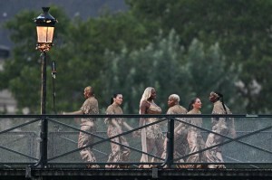 Singer Aya Nakamura and dancers perform on the Pont des Arts footbridge during the opening ceremony of the Paris 2024 Olympic Games