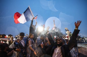 Athletes from France's delegation sail towards the Eiffel Tower along the river Seine during the Opening Ceremony of the Olympic Games Paris 2024