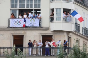 Spectators look on from windows and balconies