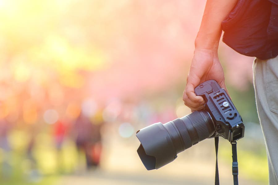 Photographer holding camera during photowalk