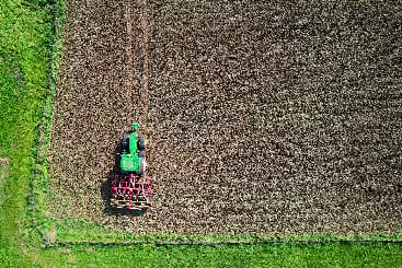 Farm tractor in a field