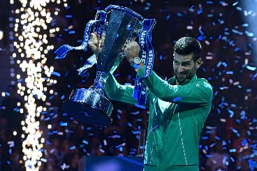 Novak Djokovic lifts the ATP Finals trophy