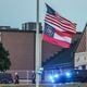 The American and Georgia flags outside Apalachee High School fly at half-staff a day after two students and two teachers were gunned down. Nine others were injured.