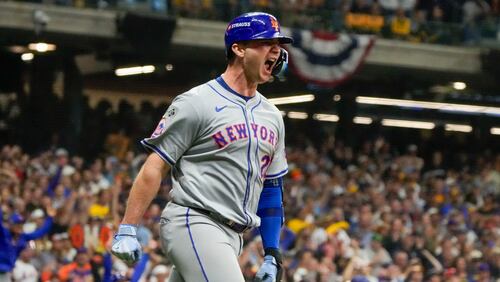 New York Mets' Pete Alonso reacts after hitting a three-run home run during the ninth inning of Game 3 of a National League wild card baseball game against the Milwaukee Brewers Thursday, Oct. 3, 2024, in Milwaukee. (AP Photo/Morry Gash)