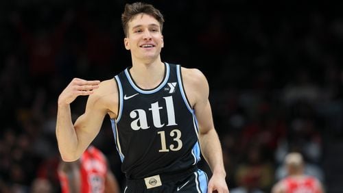 Atlanta Hawks guard Bogdan Bogdanovic (13) reacts after making a basket during the first half against the Chicago Bulls at State Farm Arena, Monday, February 12, 2024, in Atlanta. (Jason Getz / jason.getz@ajc.com)