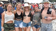 Fans did not let rain ruin their fun during day two, Duck Calls and Overalls, of the Rock the South festival in Cullman, Alabama, on Friday, July 19, 2024. (Ben Flanagan / AL.com)