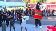 Patrons dance with mascot Wally Goose before the opening of Mobile's first Wawa store.