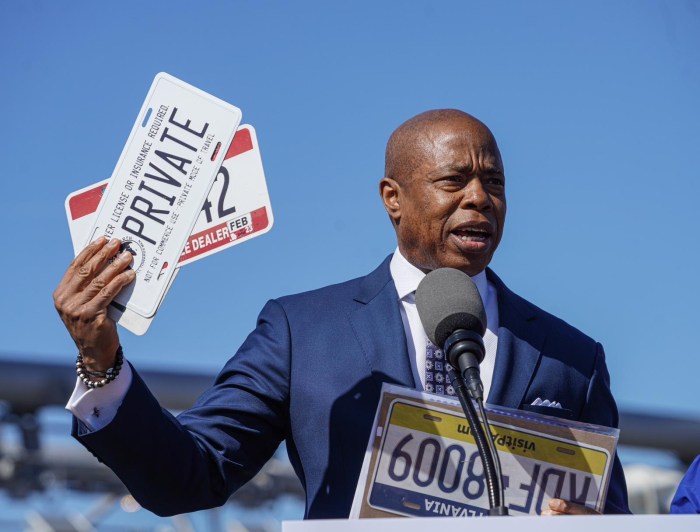 Mayor Adams holds fake plates seized by ghost car task force