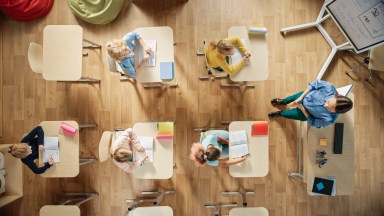 NYC test scores - students taking test in a classroom overhead shot