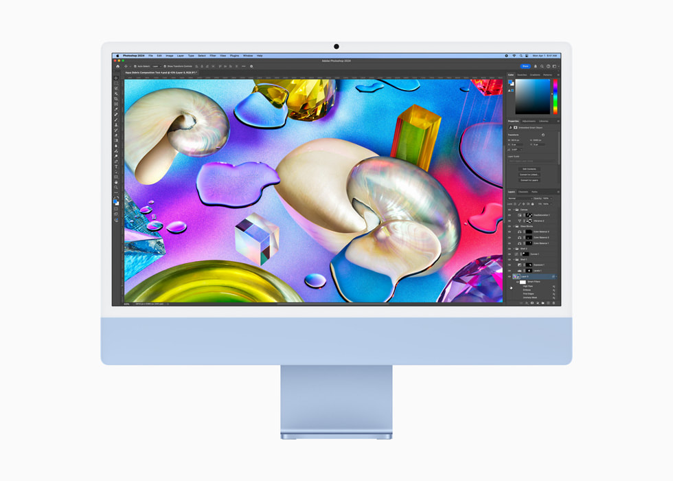 On a blue iMac, a user uses Photoshop.