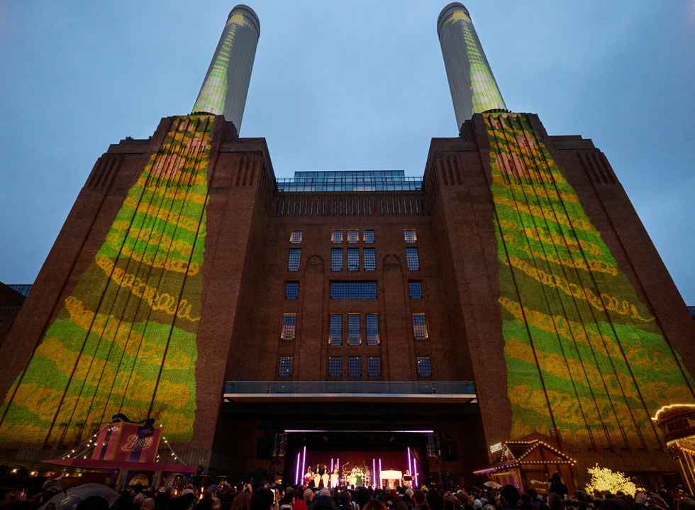 Artwork created on iPad by the students at St. George’s Primary School is projected onto the power station’s iconic chimneys.