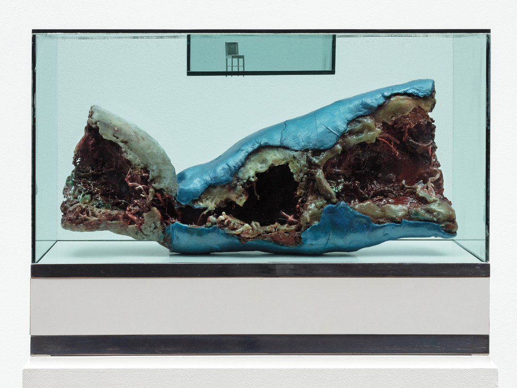 Paul Thek, Untitled (Meat Piece with Chair), 1966, wax, bronze, Formica, Plexiglas, 16 1⁄2 × 21 1⁄2 × 9 1⁄2". From the series “Technological Reliquaries,” 1964–67.