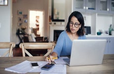 women calculating how to save on car insurance