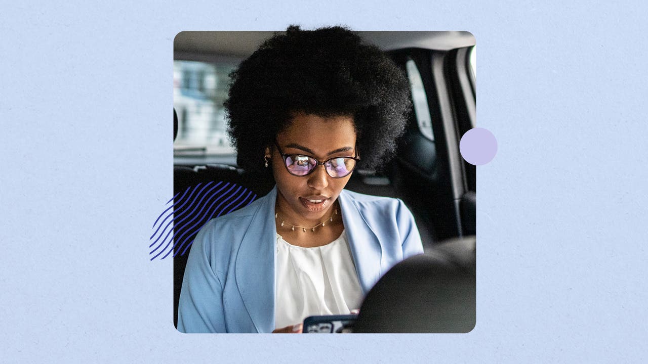 Person in the backseat of a rideshare service on their phone