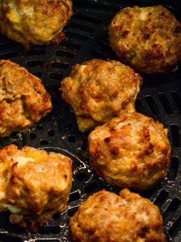 Make these delicious Air Fryer Sausage Balls with ground pork, cream cheese, Colby Jack, Parmesan, and breakfast sausage seasoning for a quick and high protein breakfast.