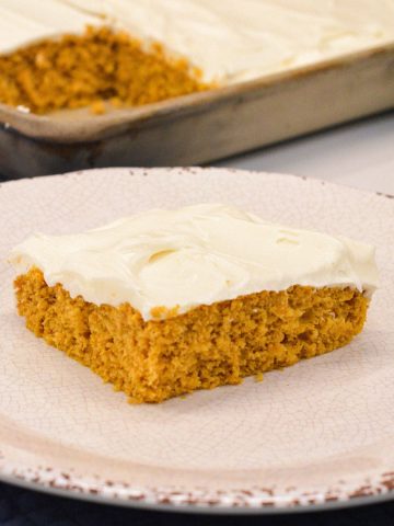 Moist, spiced, and topped with the creamiest frosting, these cake mix Pumpkin Bars with cream cheese frosting are a must-try fall dessert! Made with pumpkin puree and a box of spice cake mix, they’re simple to whip up and perfect for any gathering. Baked in a 10x15-inch pan for the ideal shareable treat.