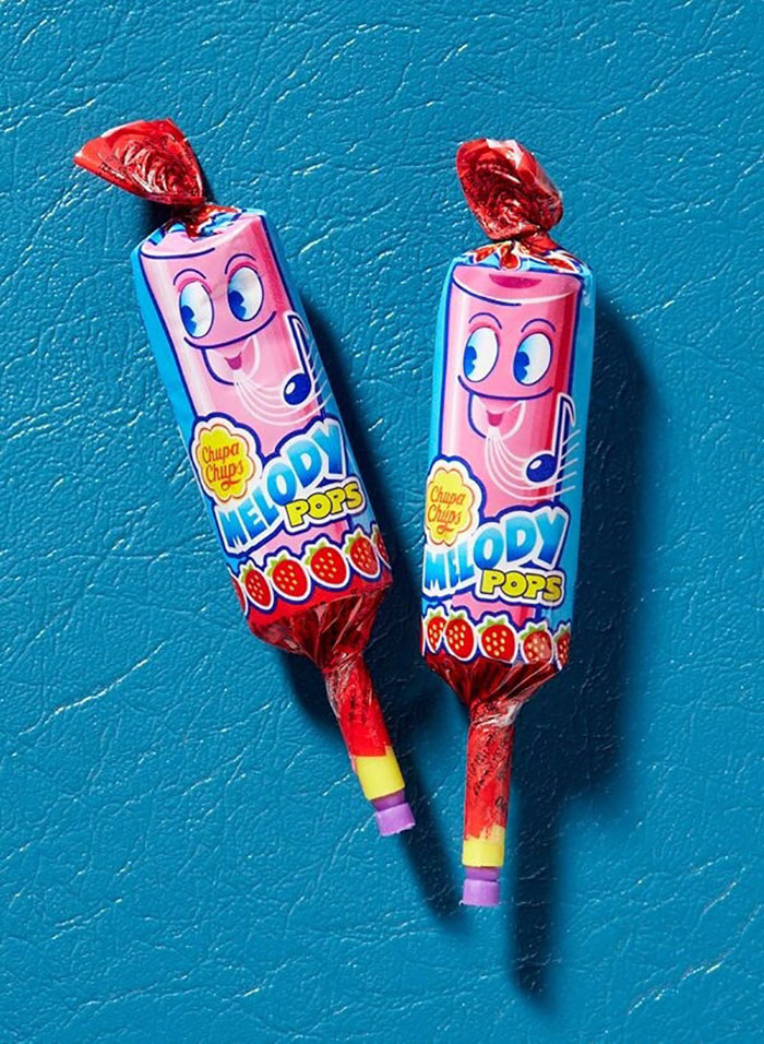 Melody Pops candy from the 90s on a blue background, showcasing nostalgic and flavorful childhood treats.