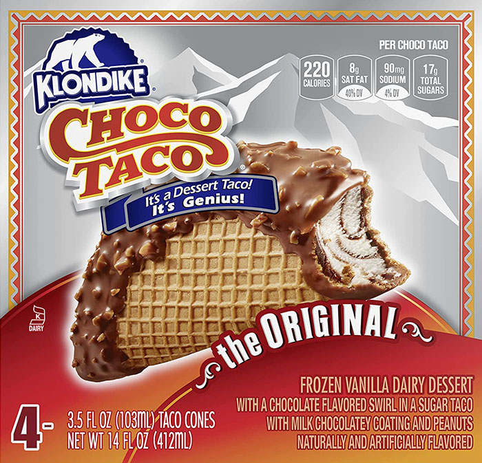 Box of Klondike Choco Taco, a popular nostalgic 90s food, with a close-up of the chocolate-covered dessert taco.