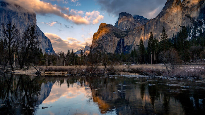 Scenic mountain landscape at sunset reflecting in a tranquil lake, showcasing incredible world photos.