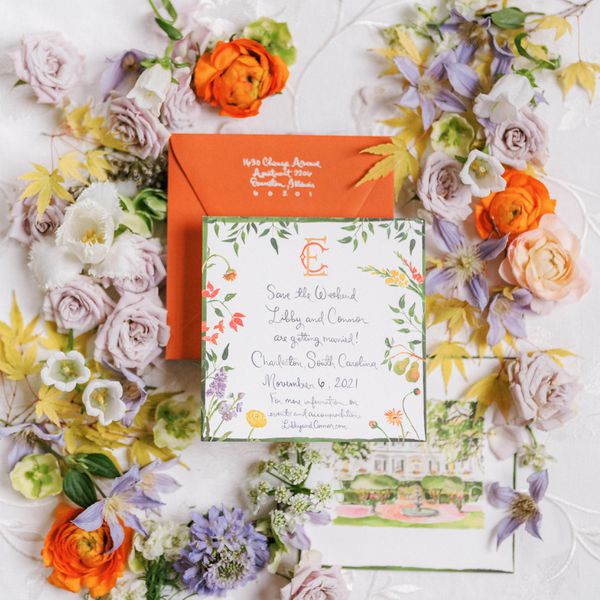 flat lay photo of an invite suite styled with flowers