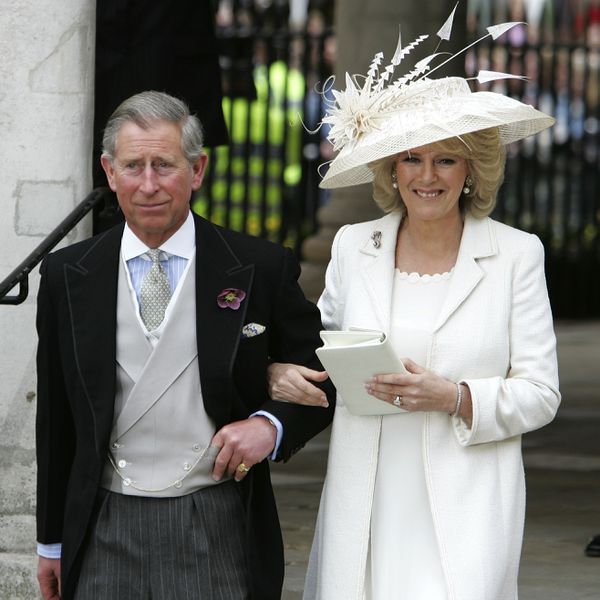 Queen Camilla and King Charles linking arms on wedding day