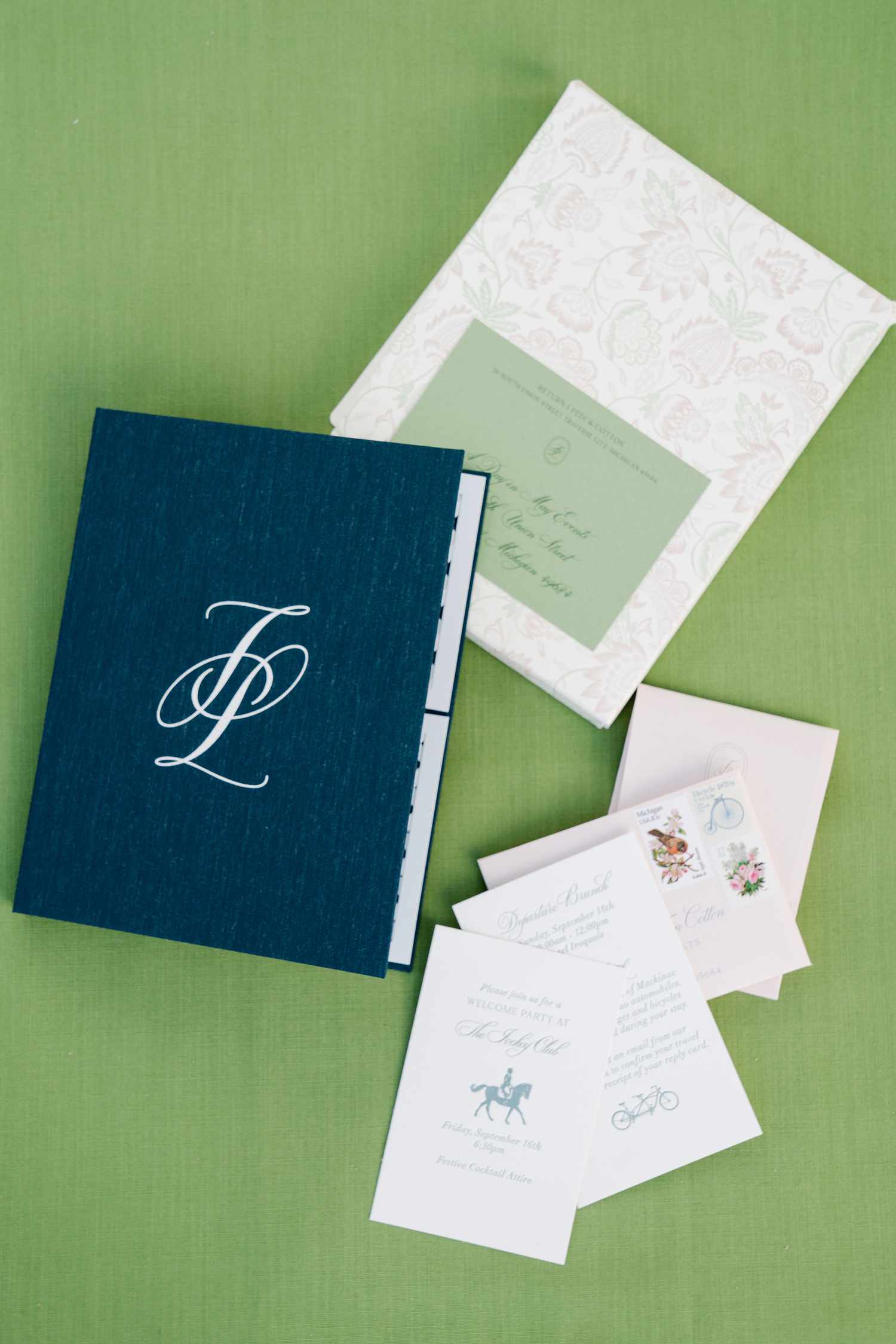 A blue linen boxed wedding invitation