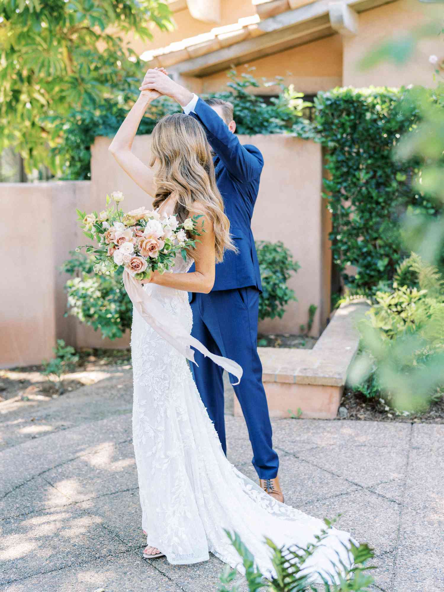 groom spins his bride at first look