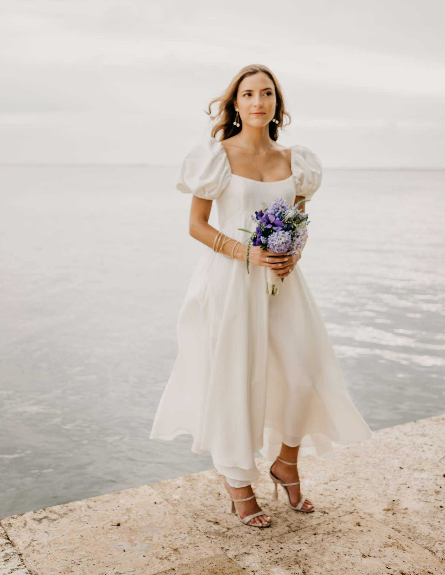 bride wearing an empire waist midi dress