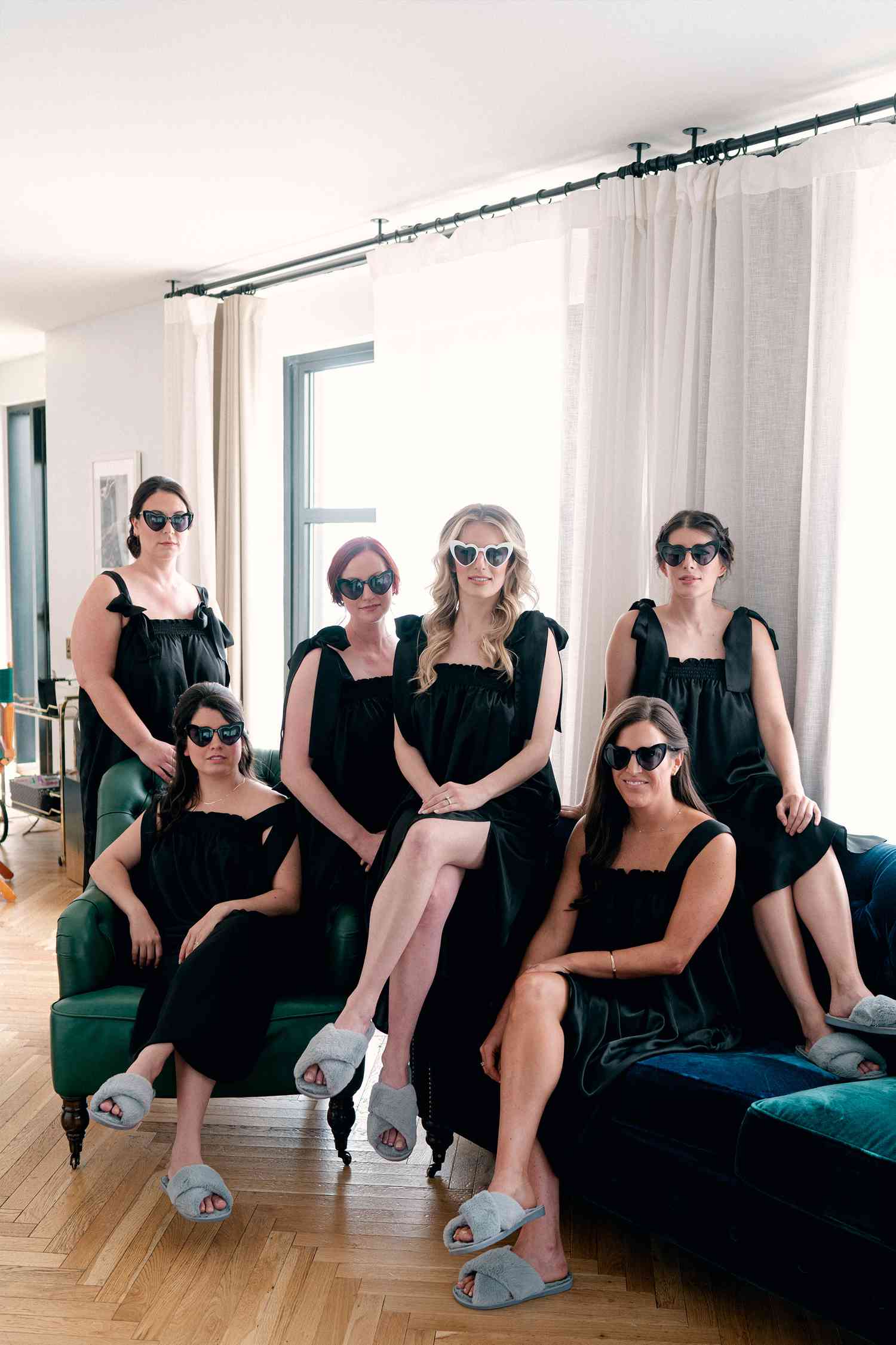 Bachelorette Party in Matching Black Dresses and Sunglasses