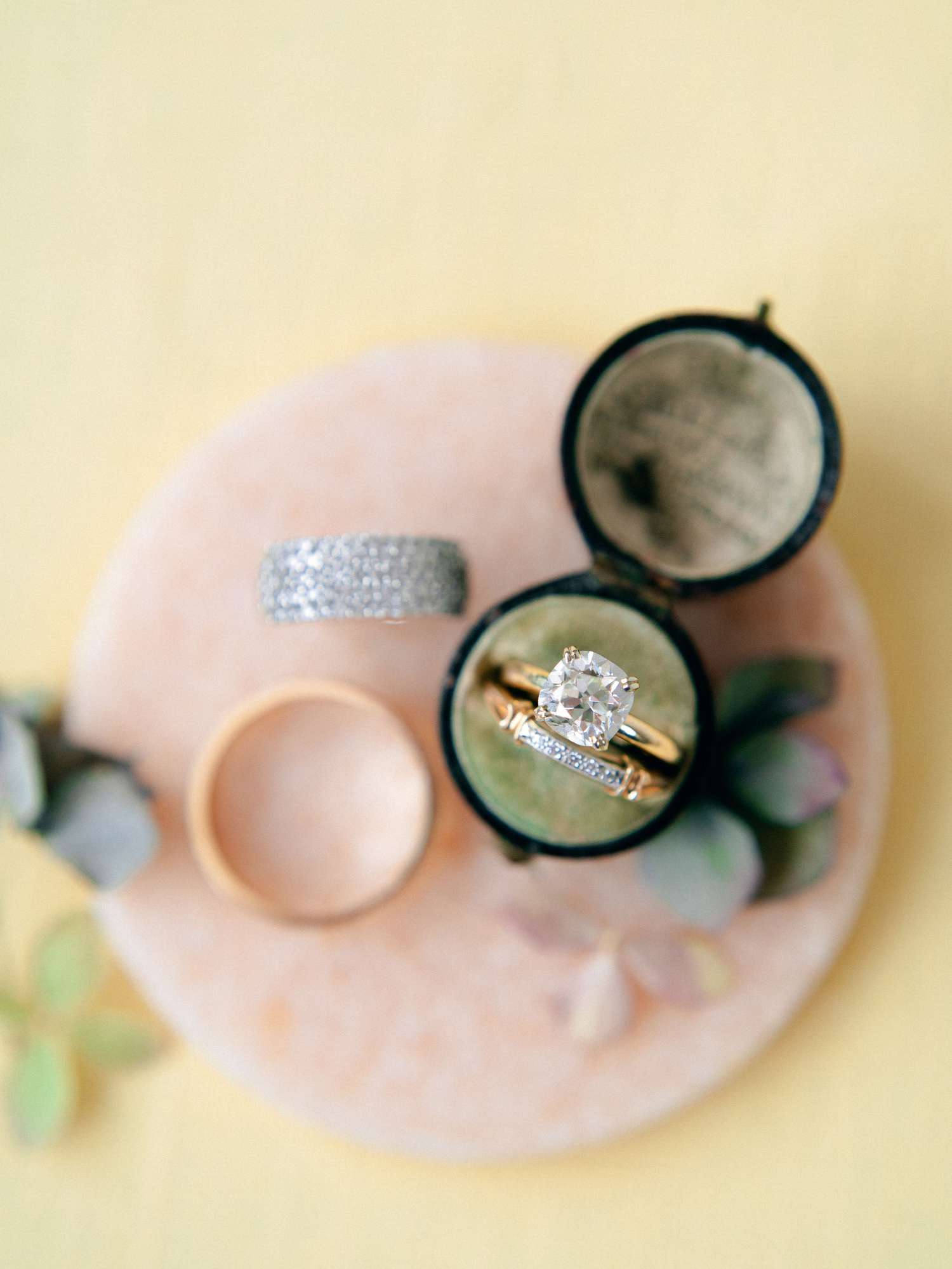 gold diamond engagement ring and wedding bad in a black ring box