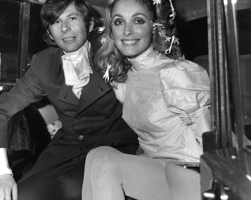 Sharon Tate With Flowers and Bows in Hair and Roman Polanski in Suit in a Car After Their Wedding