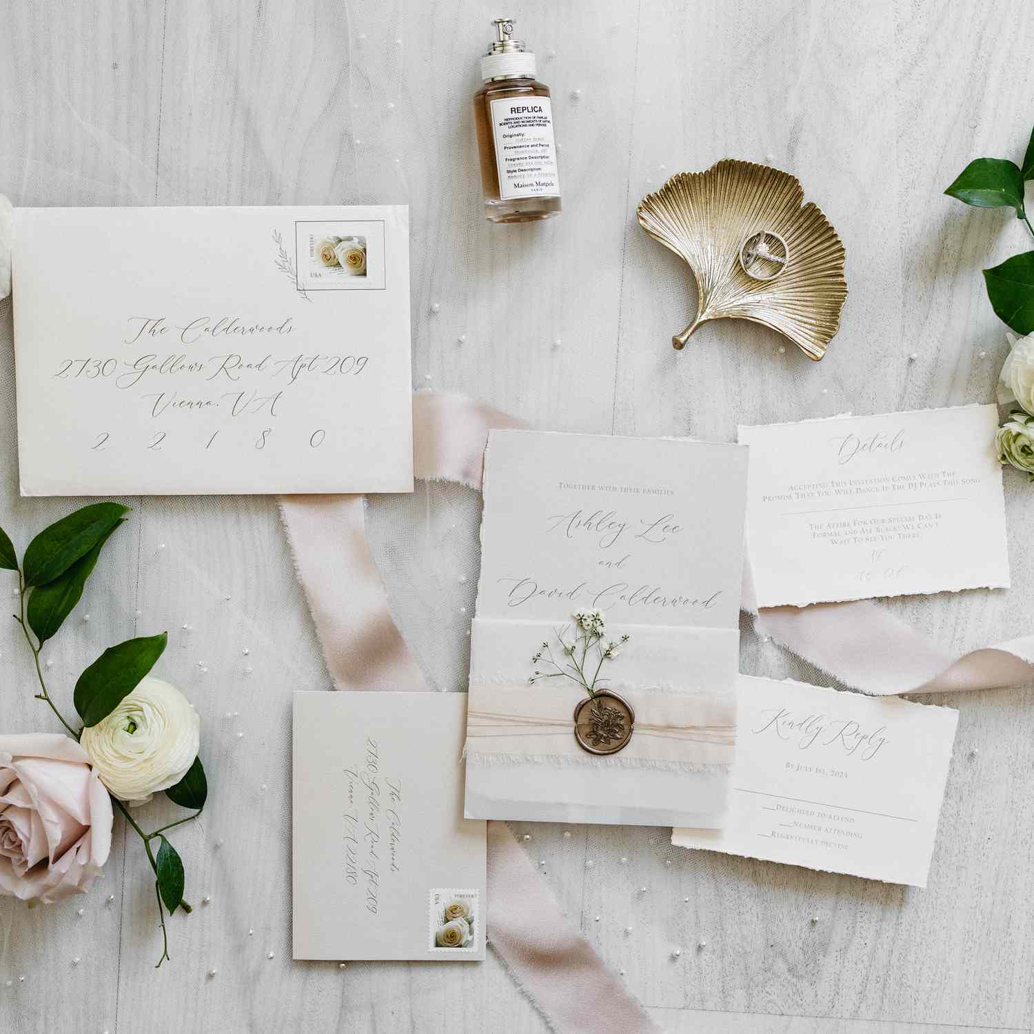 neutral wedding invitation suite with cream paper with deckle edges, pink ribbon, and gold wax seal