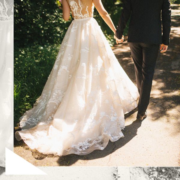 Bride in White Wedding Dress Holding Hands With Groom in Black Tuxedo